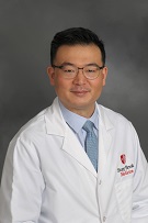 Photo of Dr. Kim in white coat