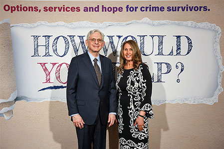 Merrick-Garland and Michelle Ballan taking a photo side by side