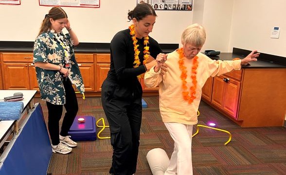 Elderly woman doing a balance excerise