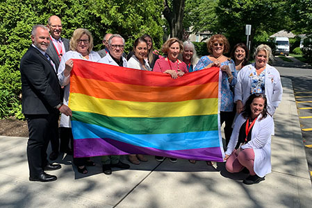 Southampton doctors holding an LGBTQ+ flag