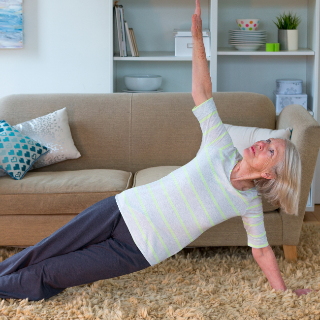 Women doing yoga on her carpet