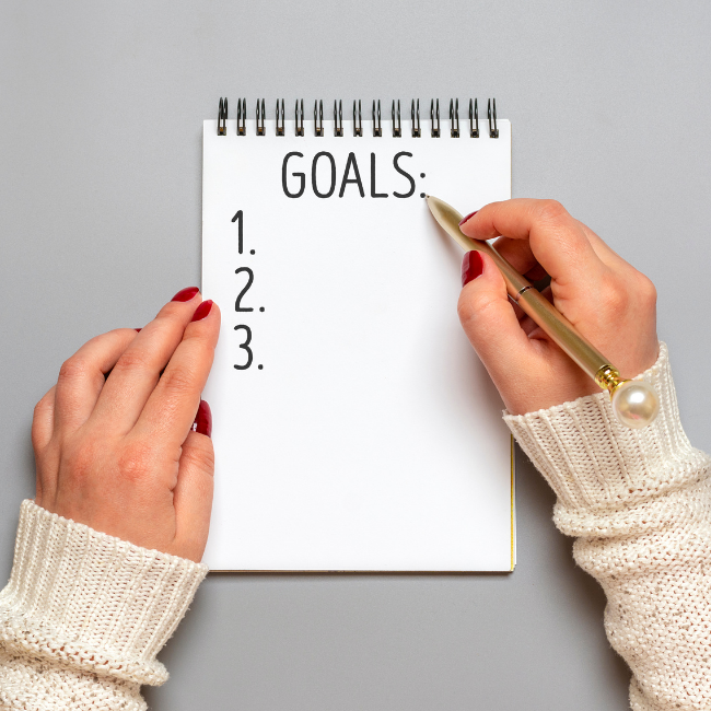 notebook with goals listed
