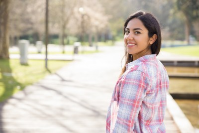 woman smiling in a park