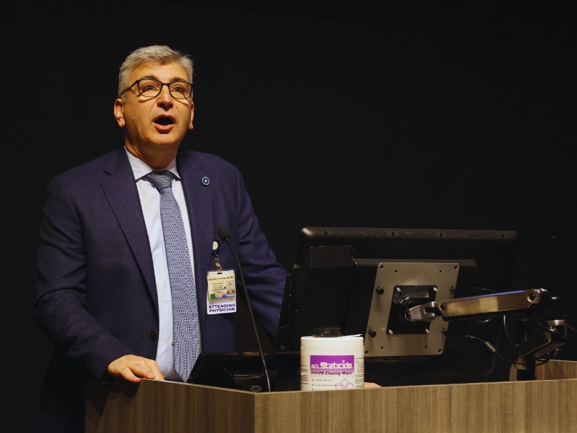 Dr. Tassiopoulos introducing Dr. Ricotta