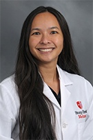 Photo of Dr. Tam in white coat