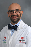 Photo of Dr. Michael Ernst in a white coat