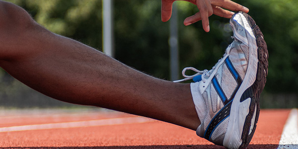 Soccer player in pain grasping knee