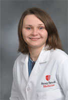 Photo of Olga Makrak Sturniolo, NP in white coat