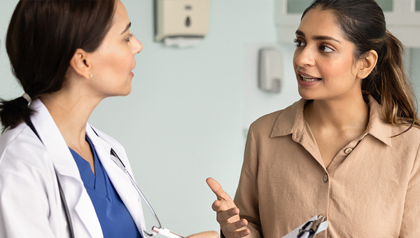 Female patient speaking with physician