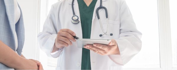 Stock photo of faceless provider seeing patient