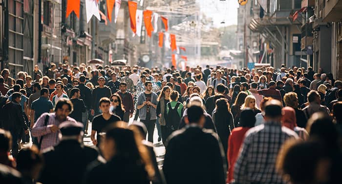 Crowded street filled with people walking