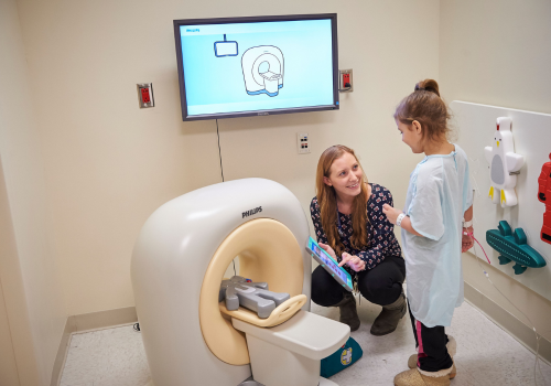 Child Life Specialist Demonstrates CT Machine