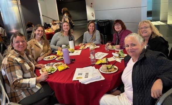 attendees at event sitting at table
