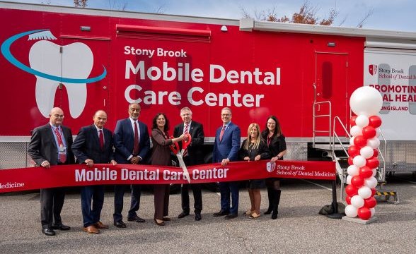 mobile dental center - opening cutting the ribbon group image